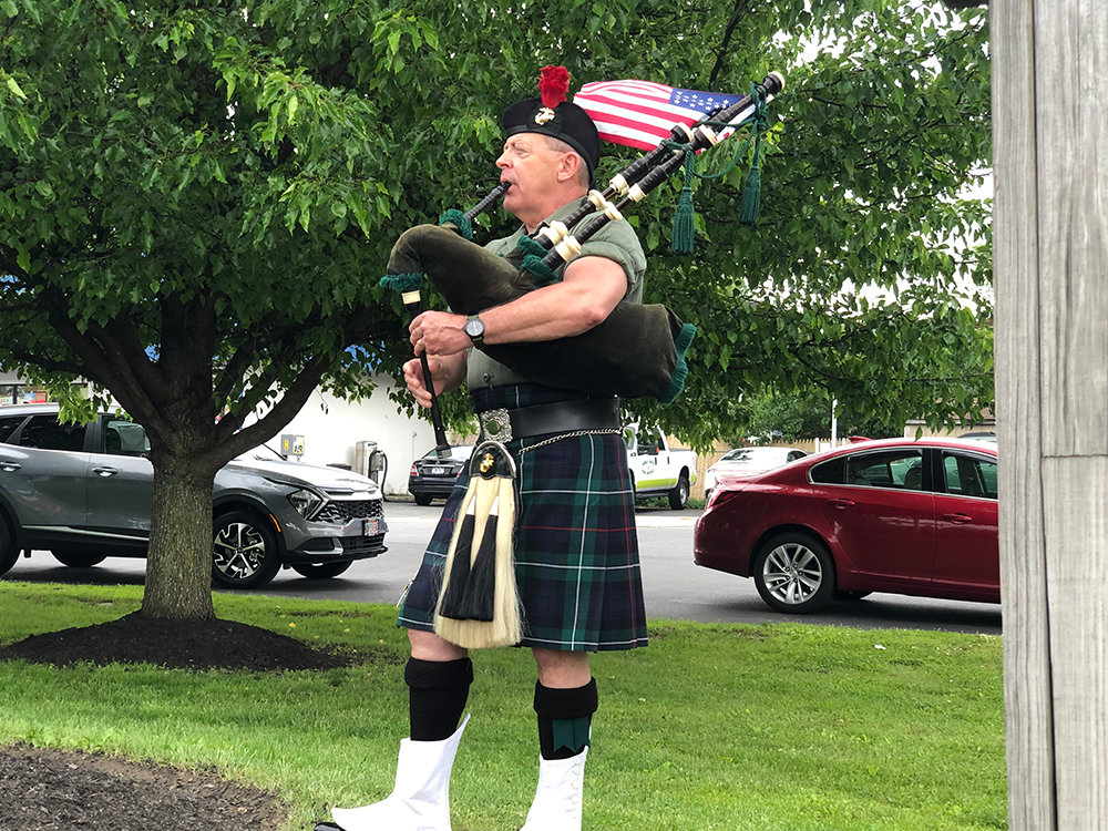 Bill Hennessey performs Amazing Grace on the bagpipes.